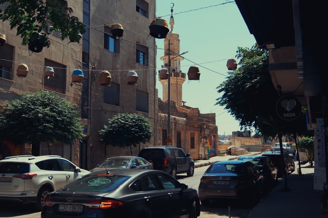 Evening on Rainbow Street, with café terraces and strings of lights along the pavement