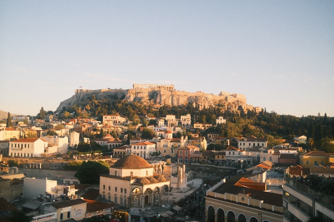 View from Lycabettus Hill over the whole of Athens at dusk, the Acropolis lit below