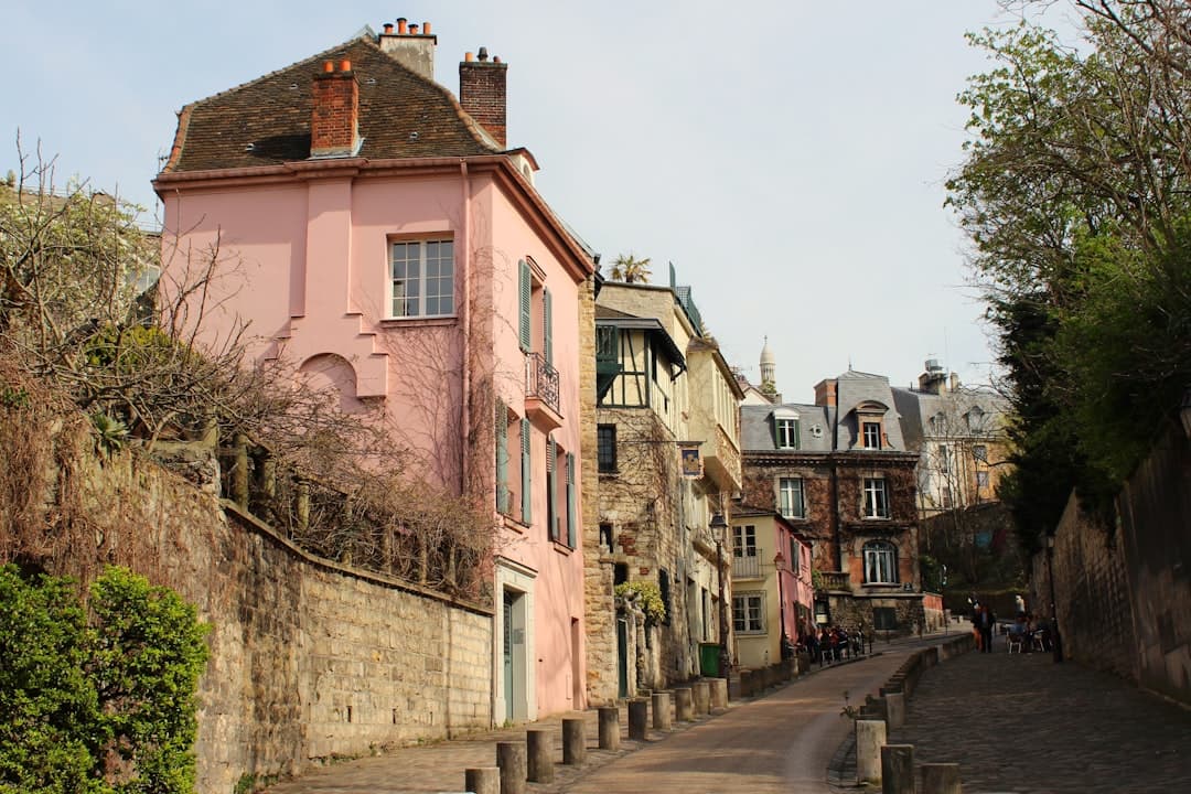 Empty steep steps and lampposts climbing to Sacré-Cœur in early light