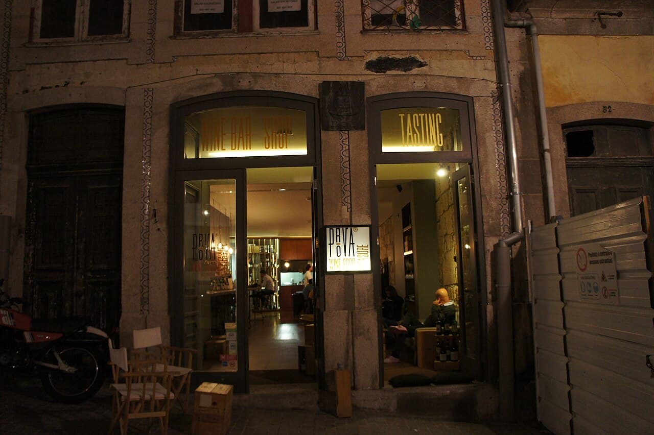 A lively bar street in central Porto at night