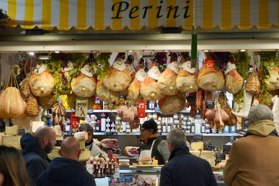 Produce stalls and lunch counters inside the modern Testaccio market hall