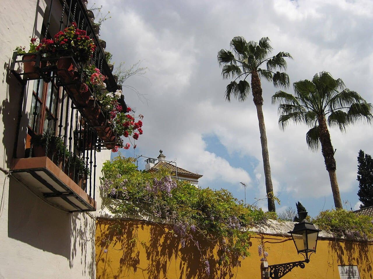 A narrow whitewashed lane in Barrio Santa Cruz, Seville