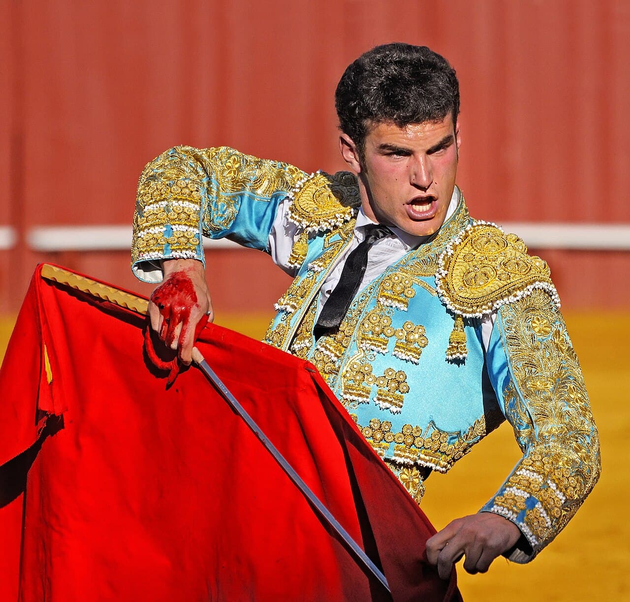 The yellow and white arcades of the Maestranza bullring, Seville