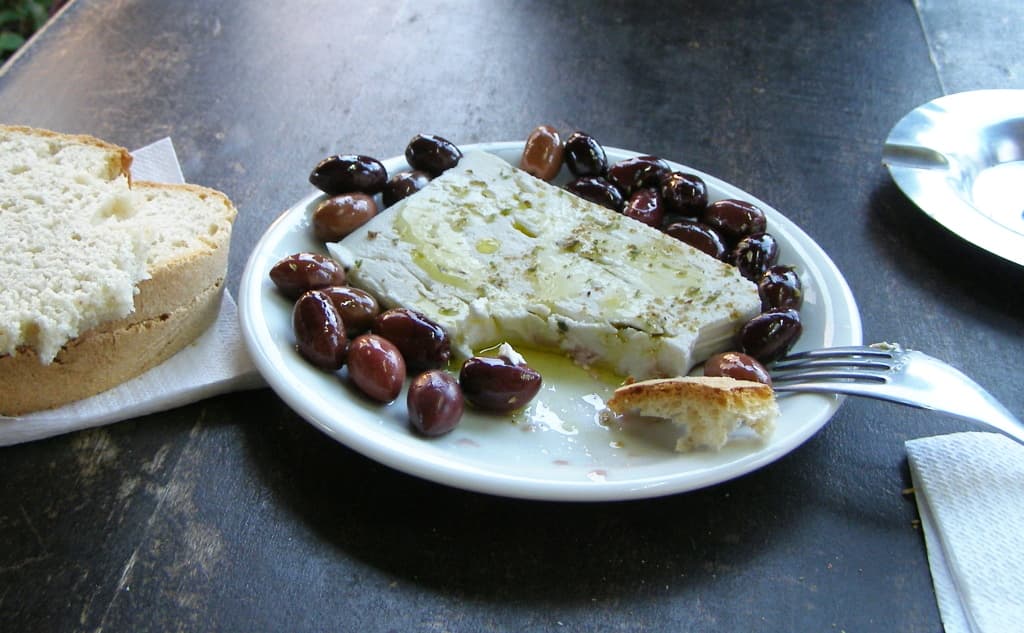 Tsipouro and meze on a Greek taverna table