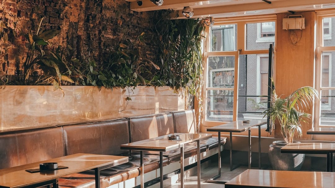 Candlelit wooden interior of a traditional Amsterdam brown café