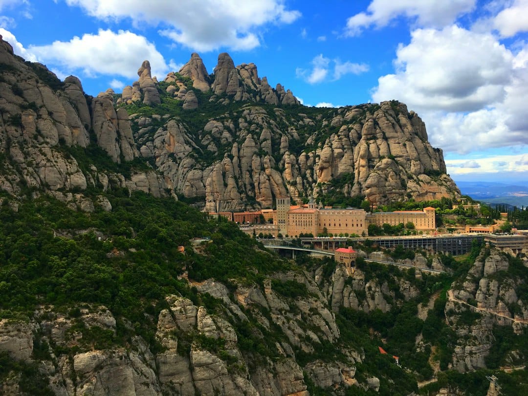 The monastery below the serrated rock pillars of Montserrat near Barcelona
