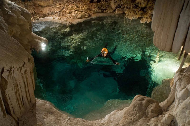 Swimmers in the underground river cave of Río Secreto near Cancún