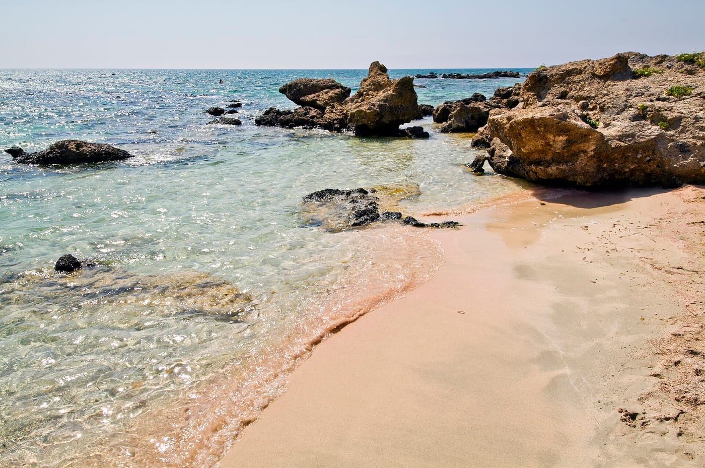 The pink sand and shallow turquoise water of Elafonisi beach in Crete