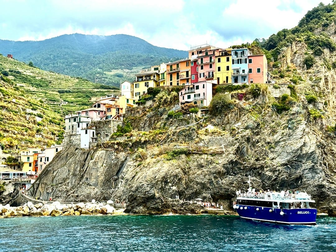 A boat passing the Cinque Terre villages