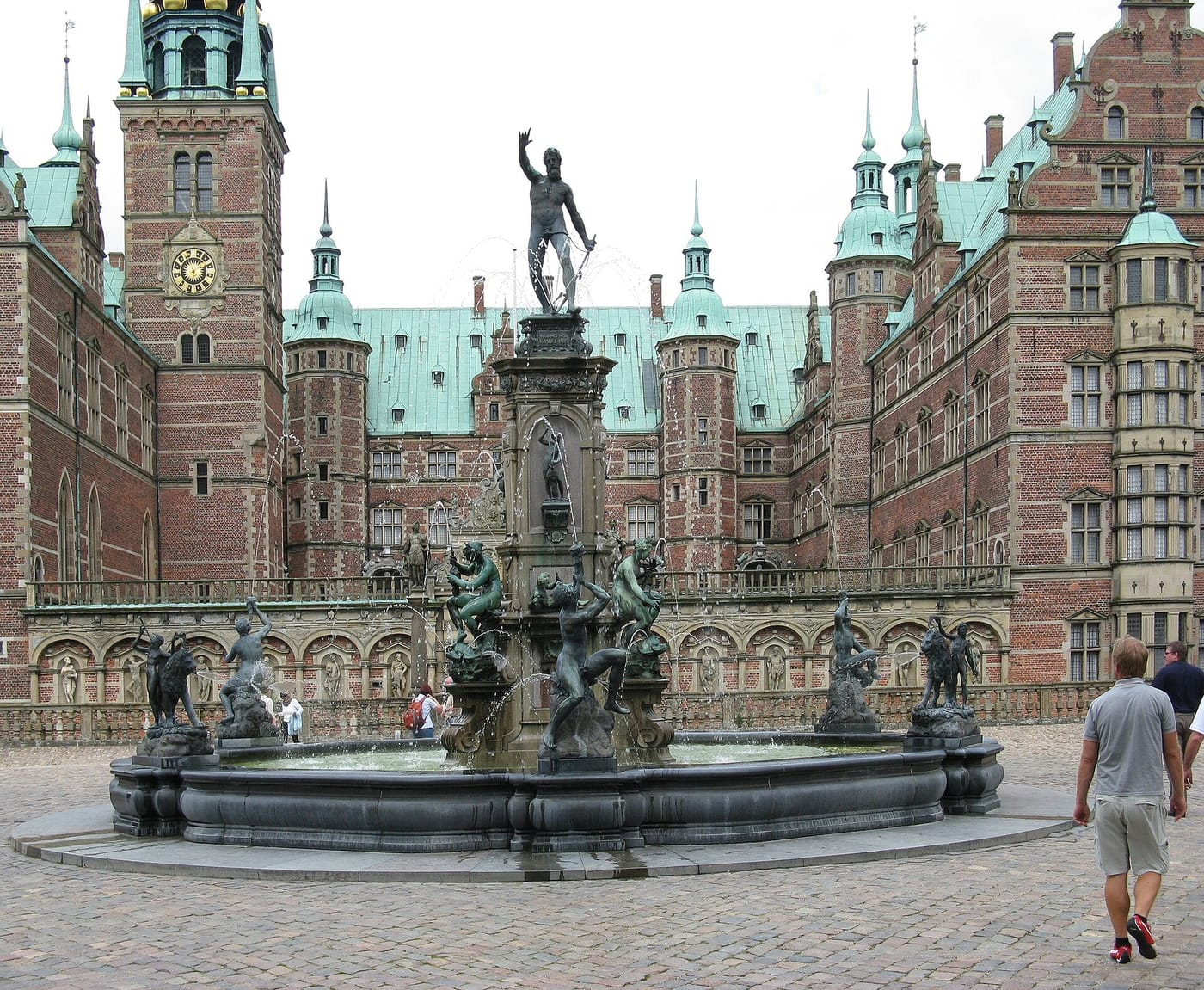 The Neptune fountain before the red-brick Frederiksborg Castle in Denmark