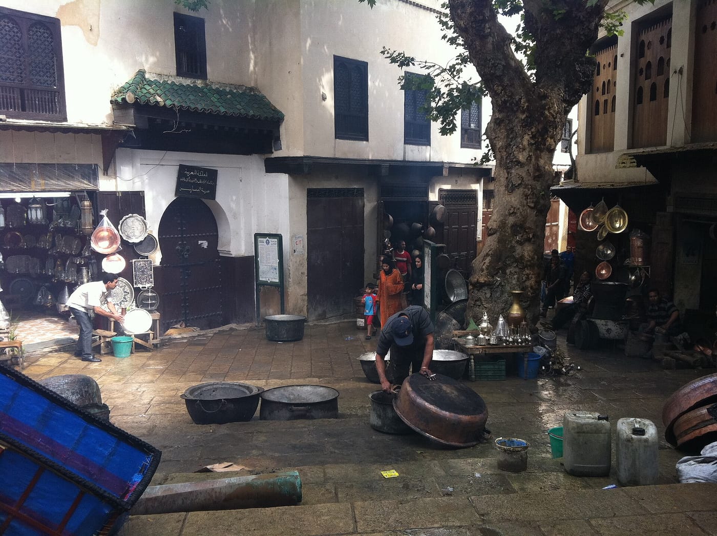 Coppersmiths at work in the Place Seffarine in the Fez medina