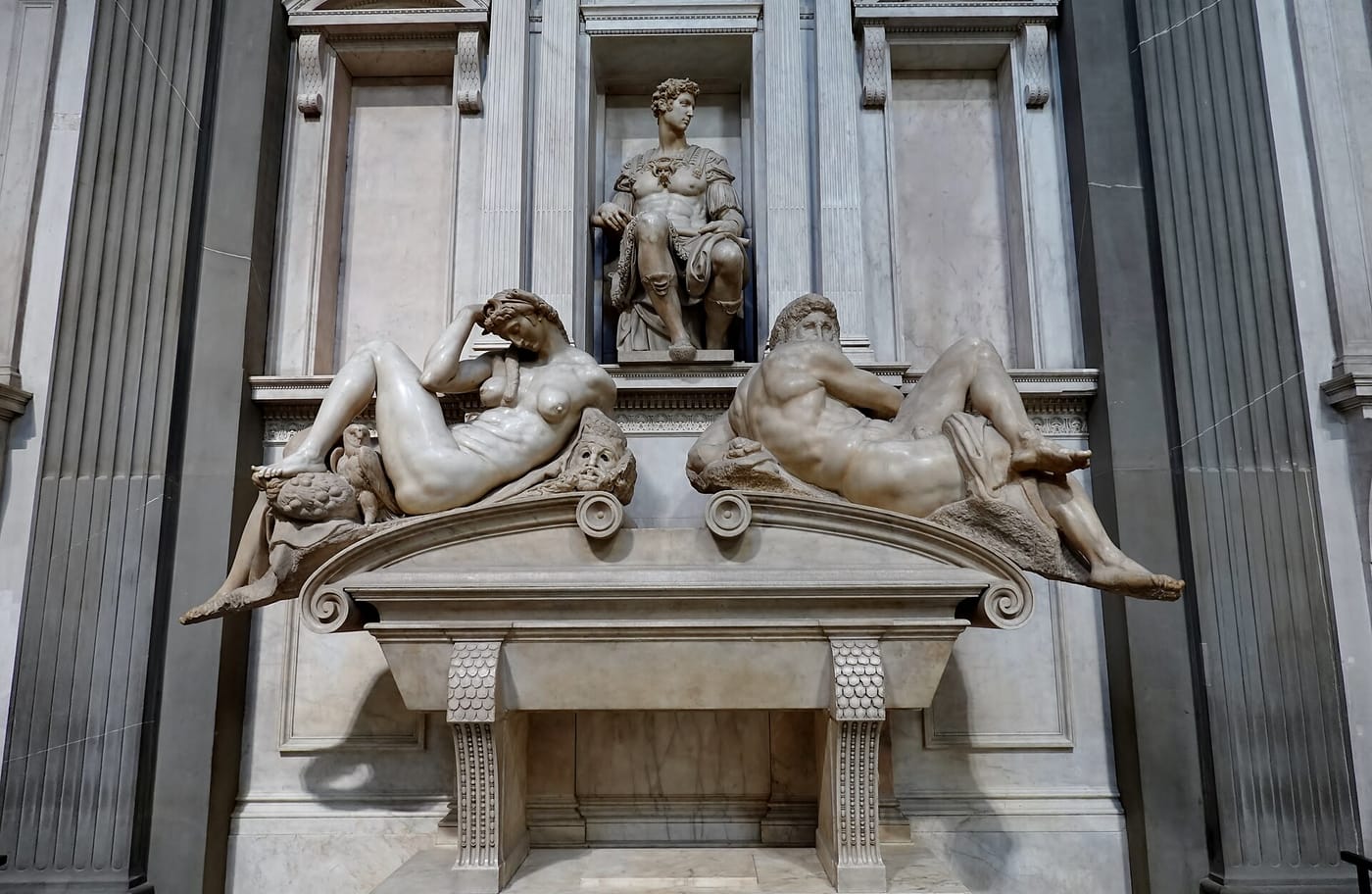 Michelangelo's reclining marble figures on a Medici tomb in Florence