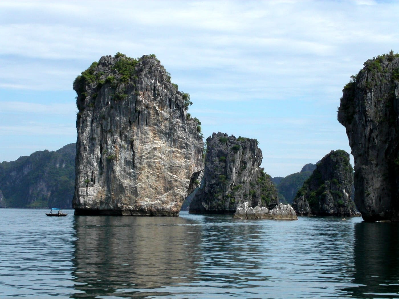 Limestone karst islands rising from the water in Ha Long Bay, Vietnam