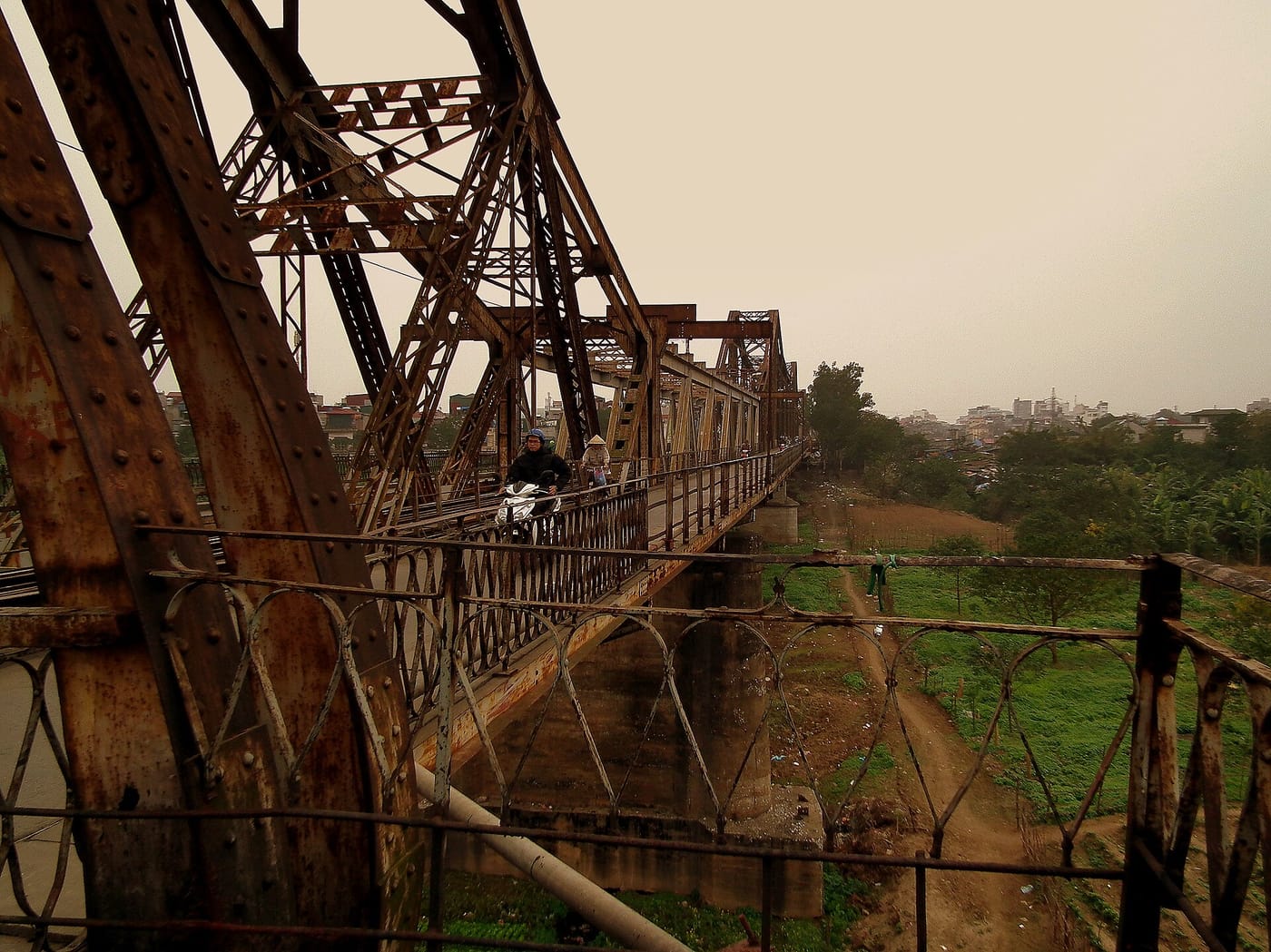The old steel girders of the Long Bien Bridge over the Red River in Hanoi