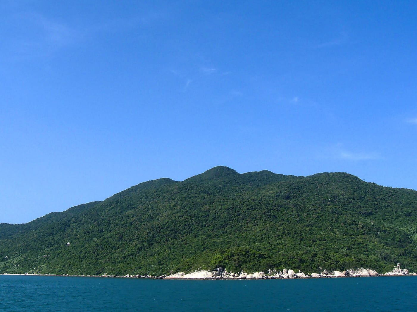 A green island rising from the sea in the Cham Islands off Hoi An