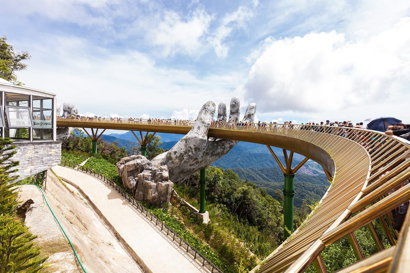 The Golden Bridge held up by giant stone hands at Ba Na Hills, Vietnam