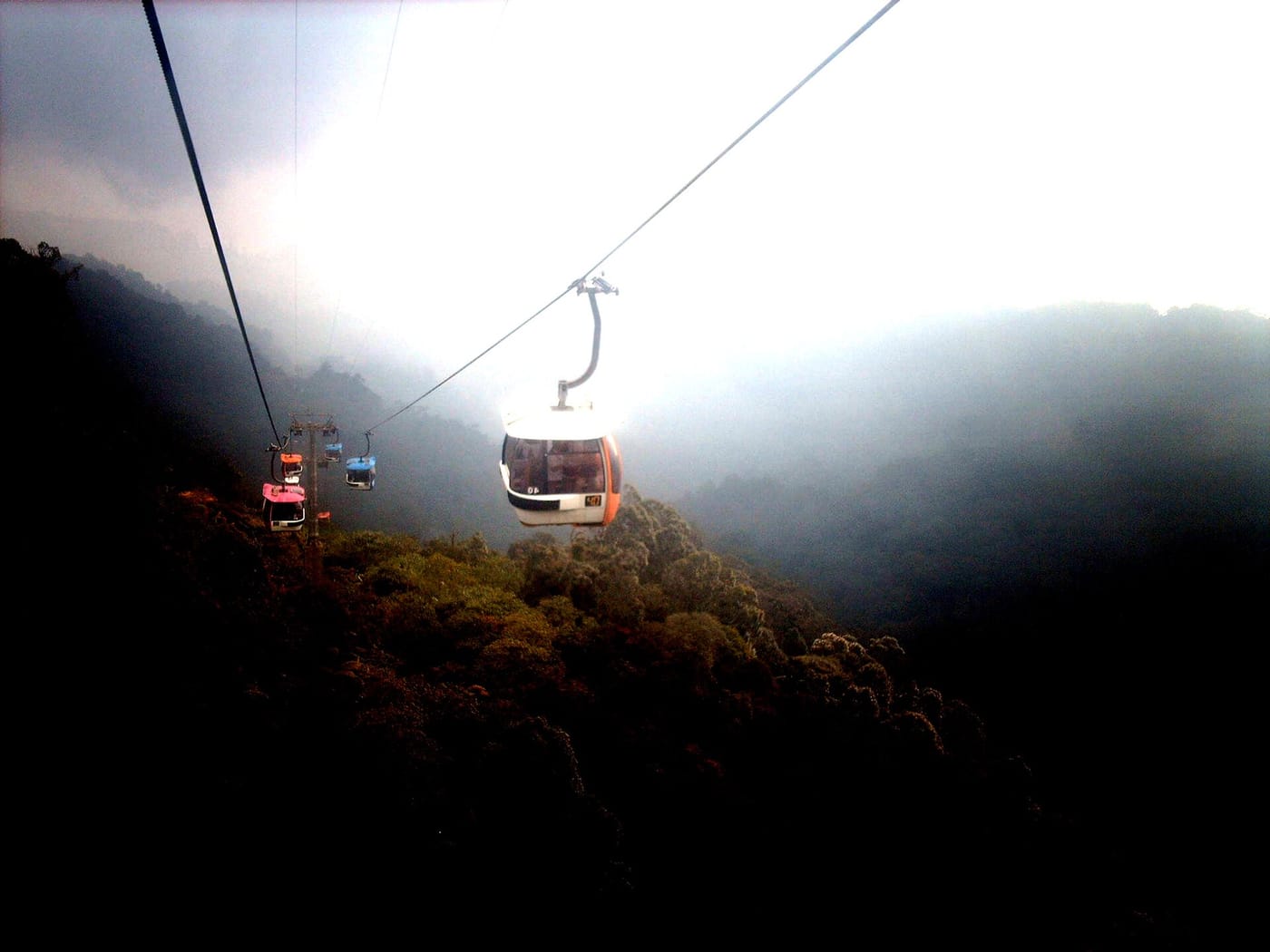 A cable car rising into the mist at Genting Highlands, Malaysia