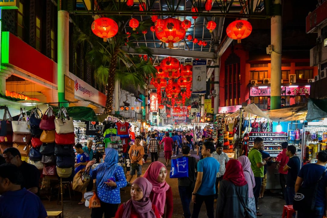 Crowds and stalls at a night market in Kuala Lumpur