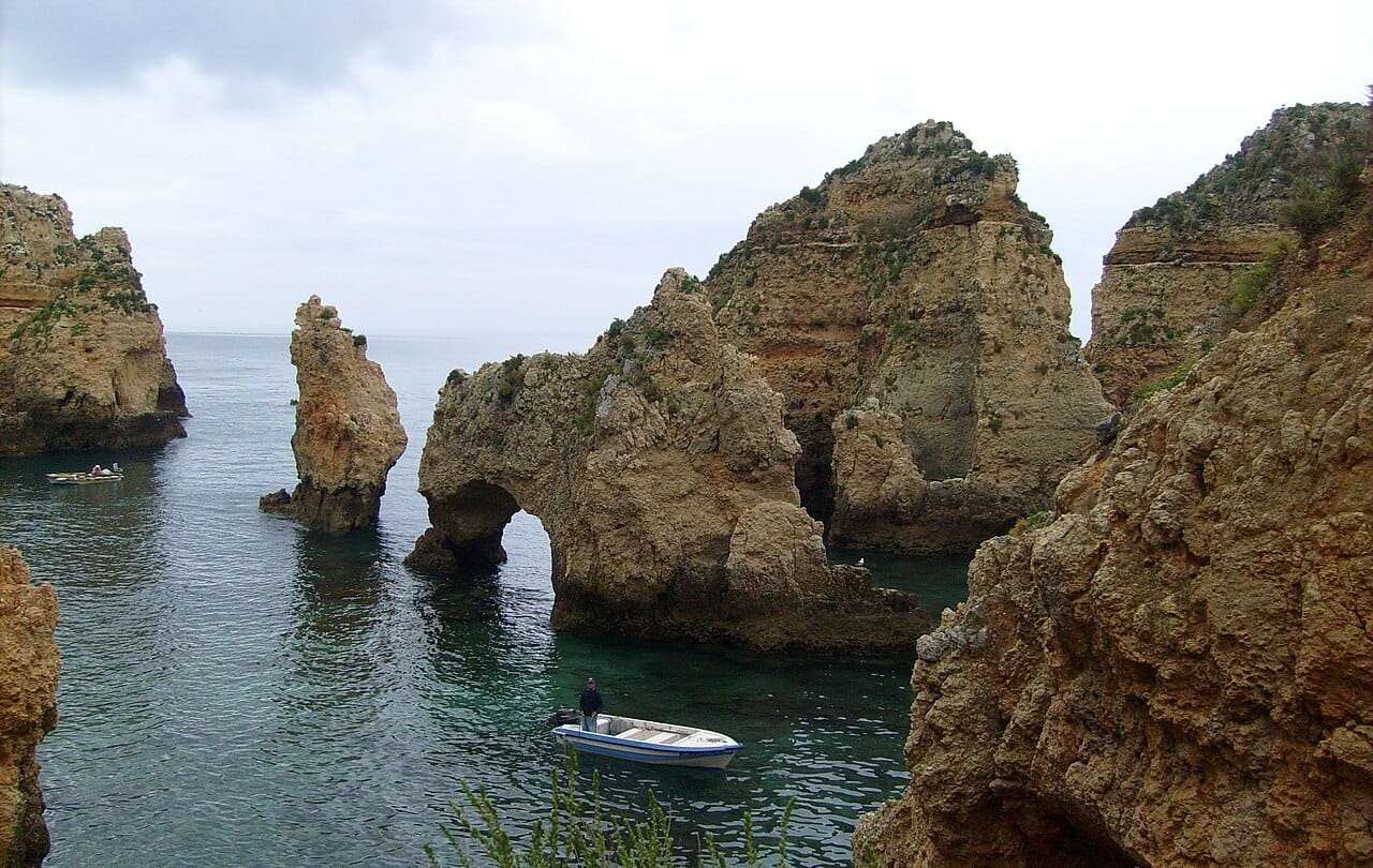 A boat among the sea caves near Lagos