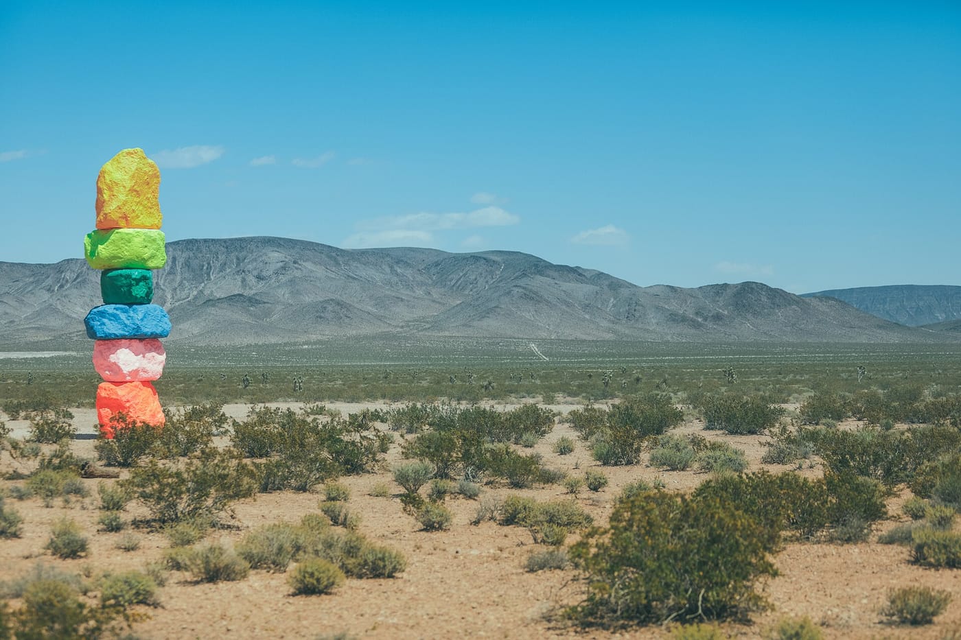The brightly painted stacked-boulder totems of Seven Magic Mountains in the Nevada desert