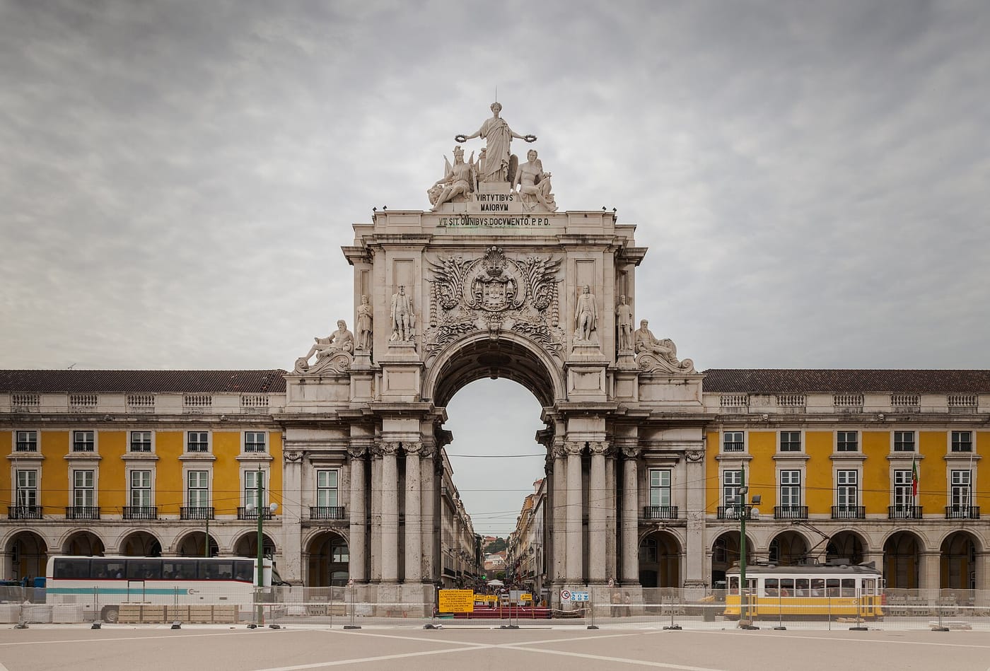 The triumphal arch and arcaded Praça do Comércio by the river in Lisbon