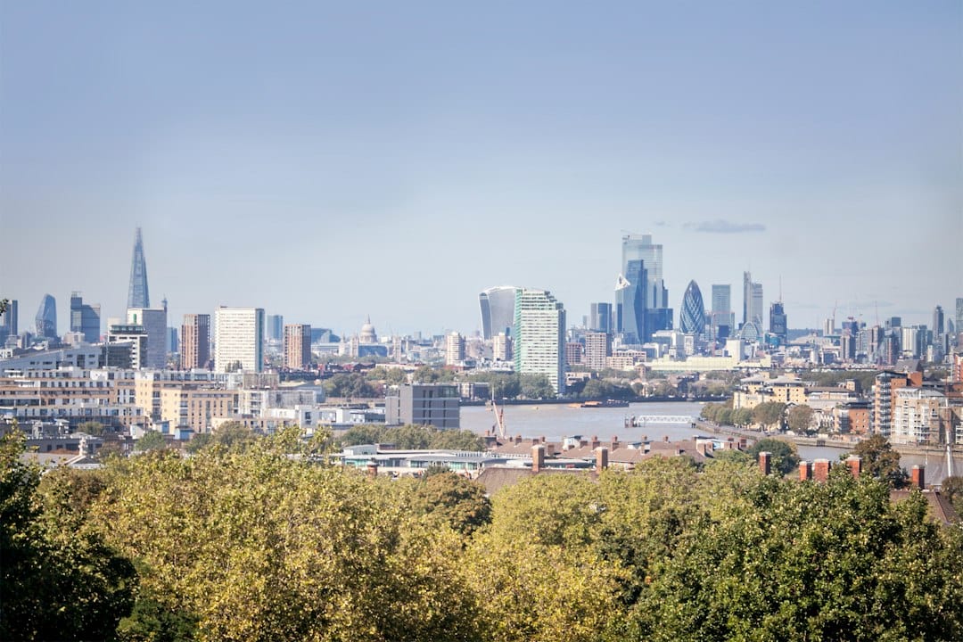 The London skyline viewed across the grass from Primrose Hill