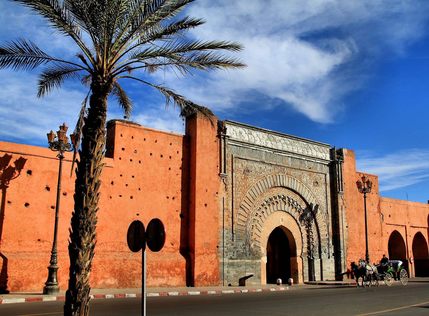 The carved sandstone Bab Agnaou gate in the red walls of Marrakech