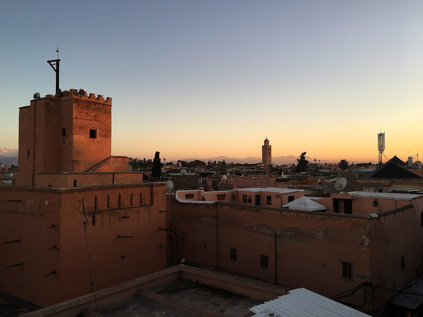 A rooftop view over the Marrakech medina at sunset