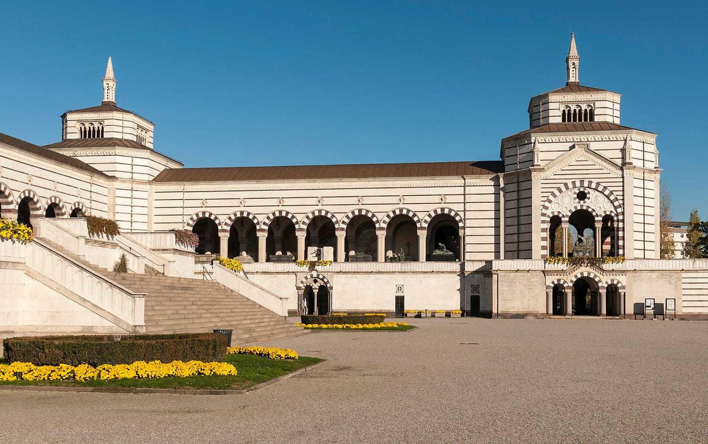 The grand arcaded entrance of the Cimitero Monumentale in Milan