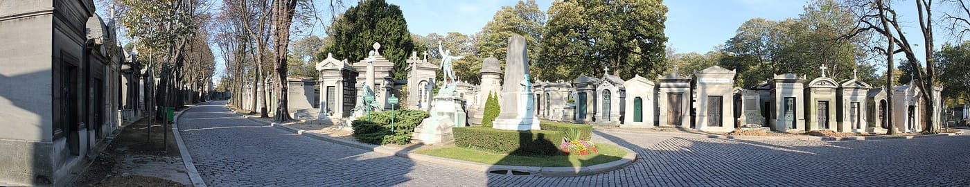 An avenue of grand tombs and statues in Père-Lachaise Cemetery in Paris