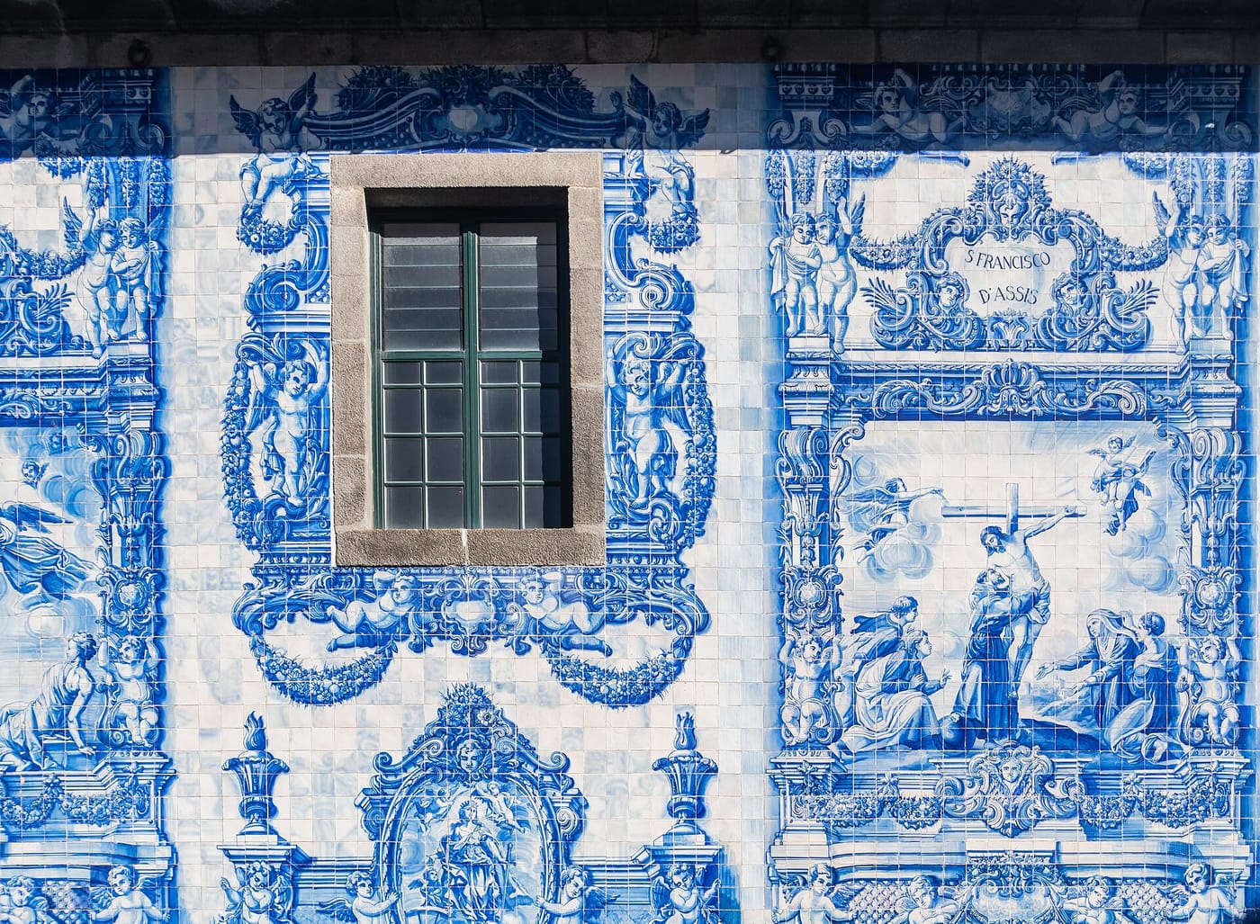 The blue-and-white azulejo-tiled facade of the Capela das Almas in Porto