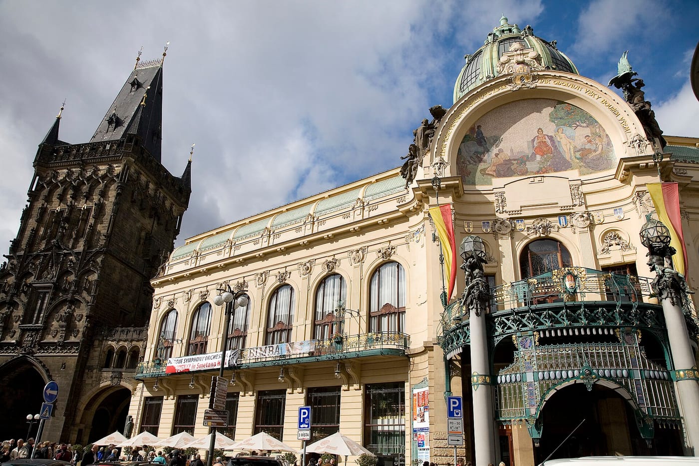 The Art Nouveau facade of the Municipal House beside the Powder Tower in Prague