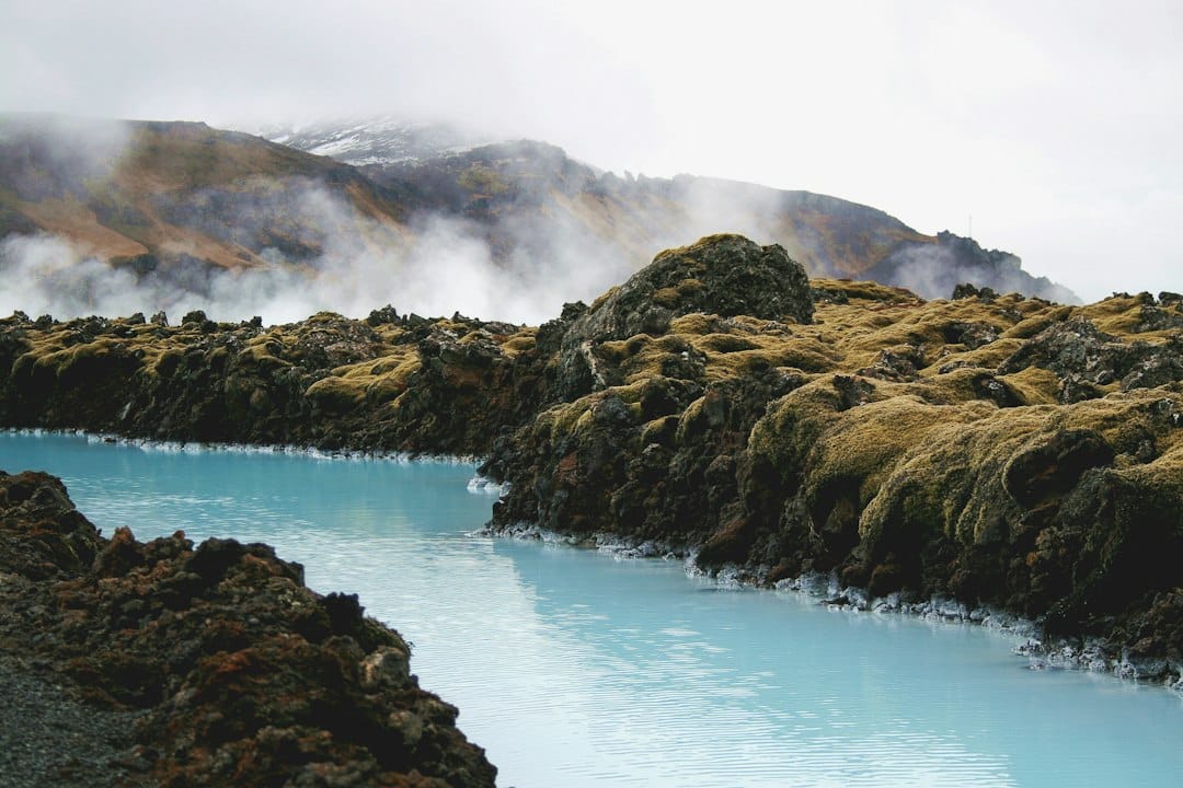 The milky-blue geothermal water of the Blue Lagoon in a lava field, Iceland