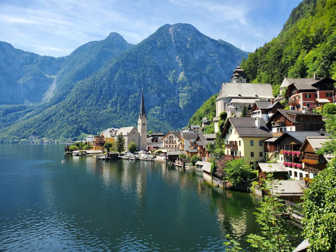 The lakeside village of Hallstatt reflected in the water below the mountains