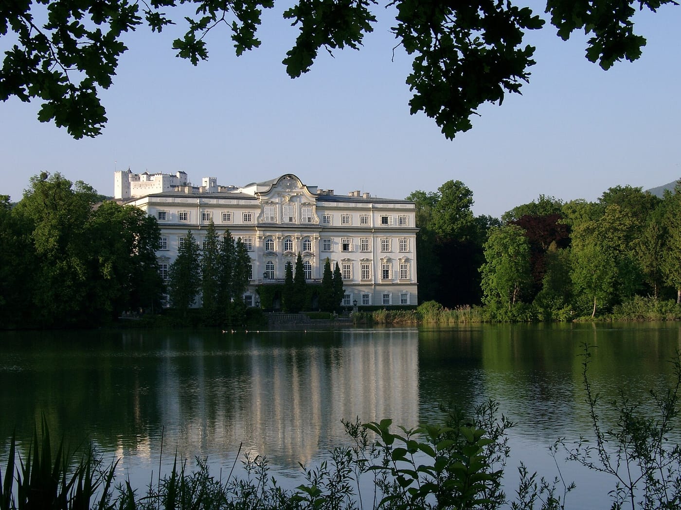 The Schloss Leopoldskron palace reflected in its lake in Salzburg