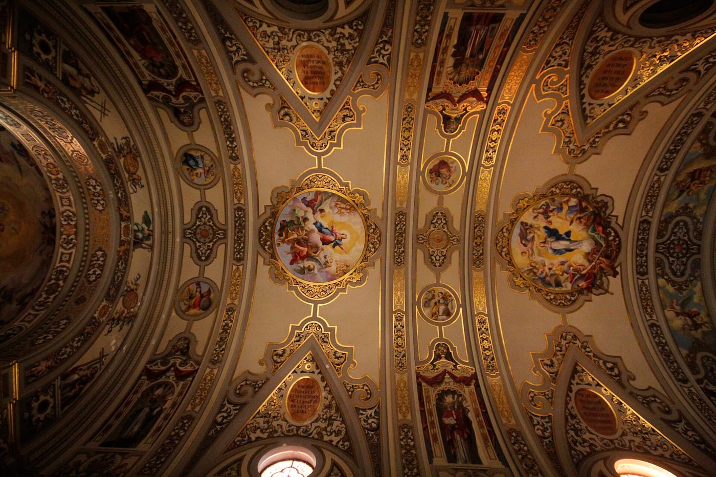 The ornate gilded ceiling of the Basílica de la Macarena in Seville