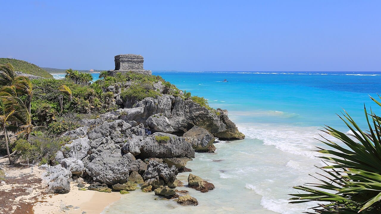 Palm-fringed white-sand Caribbean beach at Tulum