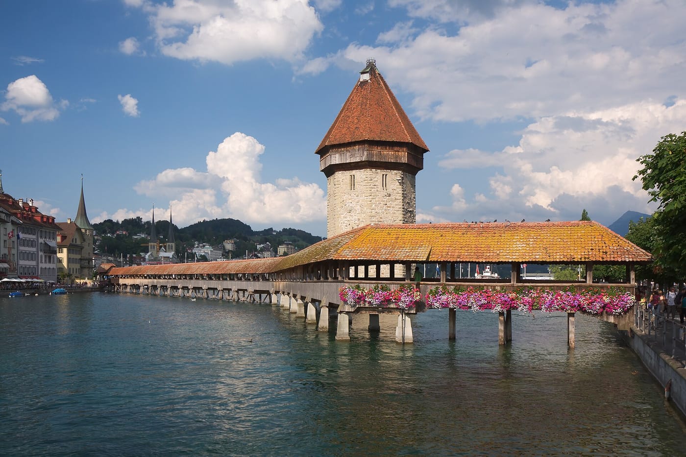 The covered Chapel Bridge and water tower in Lucerne, Switzerland